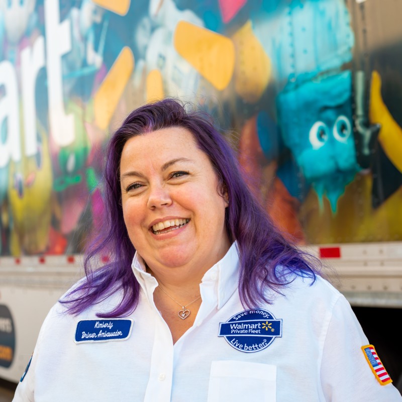 Kimberly standing in front of a truck