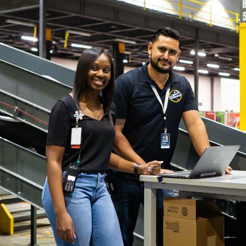 Team members around a laptop