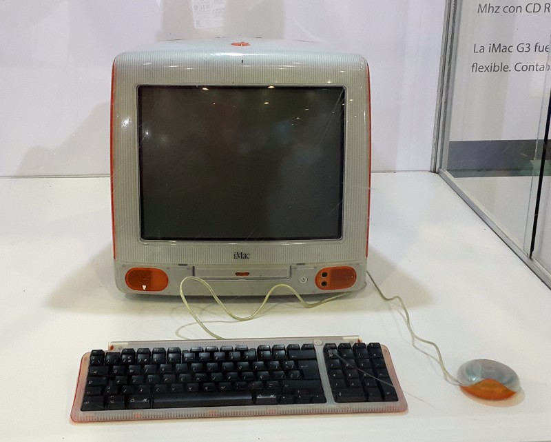 Photo of an orange iMac G3 computer in the Computer History Museum, Mountain View, CA.